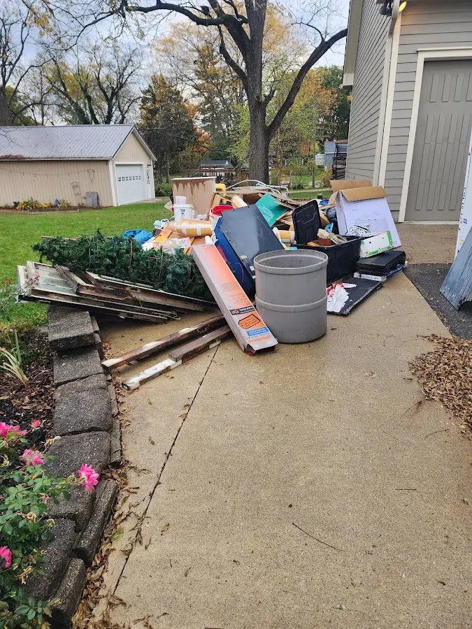 Dumpster being loaded with debris for 3 Yard Dumpster Rental in Alachua